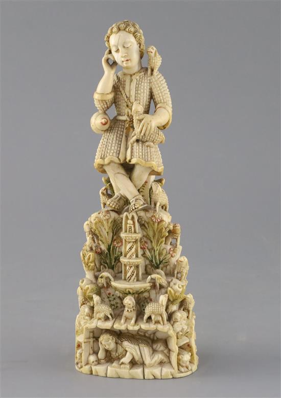 A 17th/18th century Indo-Goanese painted ivory group of Christ as the Good Shepherd, H.9.5in.